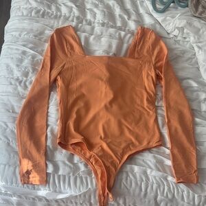 Francesca's Collections Orange Long Sleeve Bodysuit